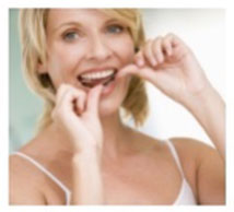 Women Flossing Her Teeth