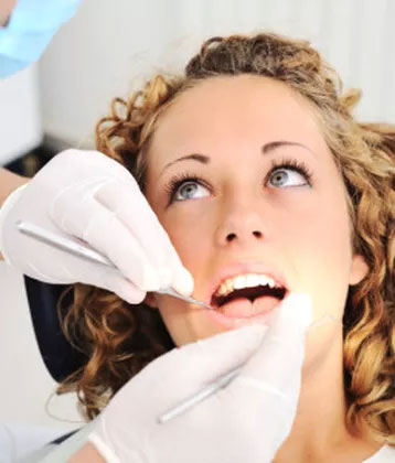 Woman getting a dental exam